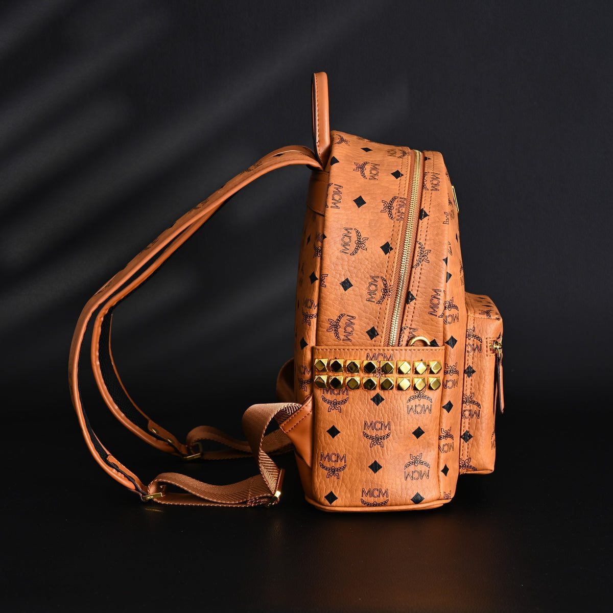 MCM Stark Visetos Medium Backpack – Cognac Monogram with Gold-Tone Studs